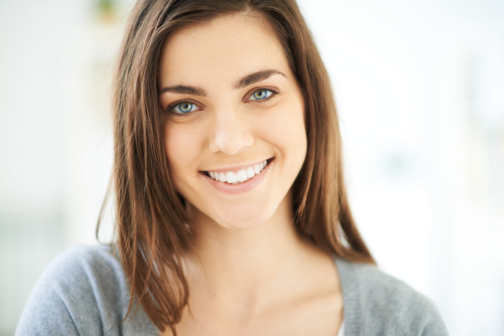 A woman smiling