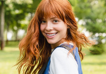 Red haired smiling woman with beautiful eyes