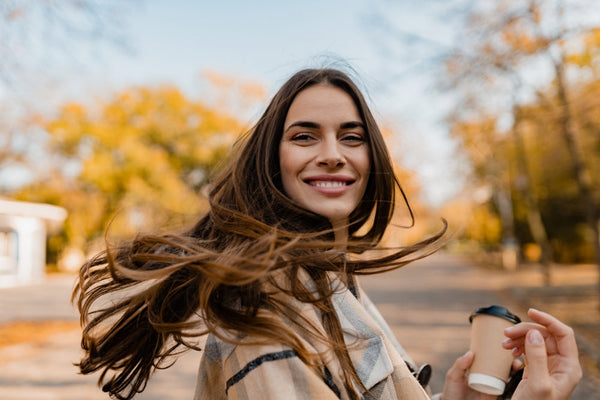 A smiling woman in fall