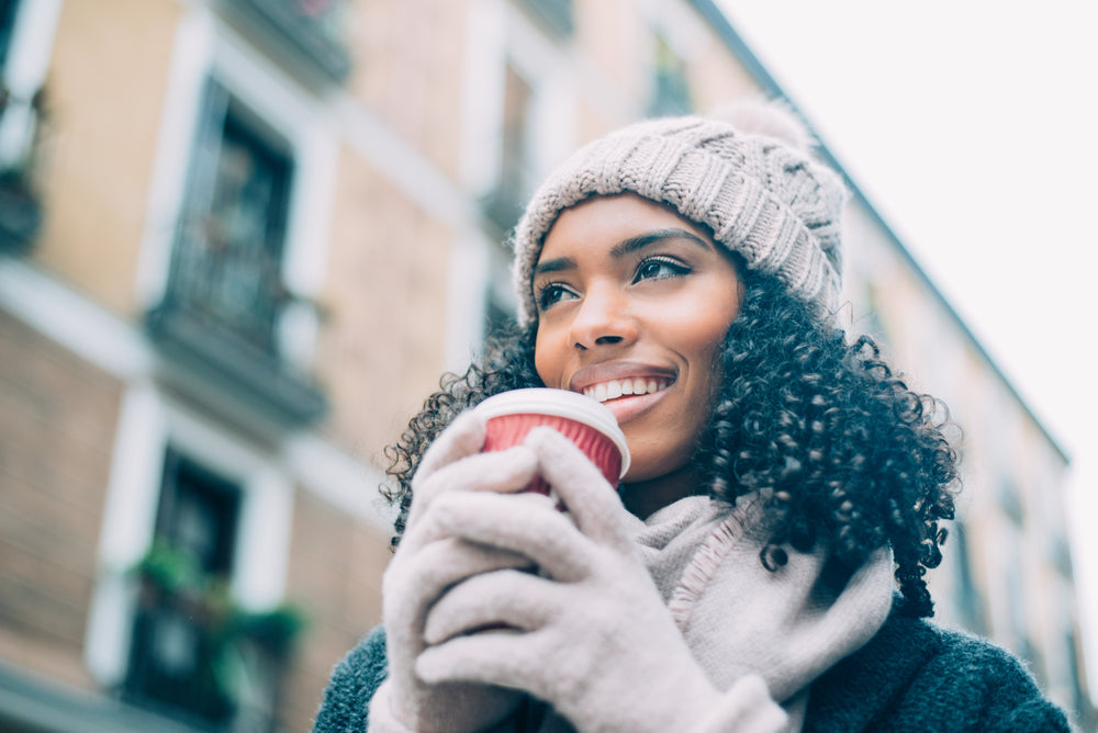 a smiling black woman in winter